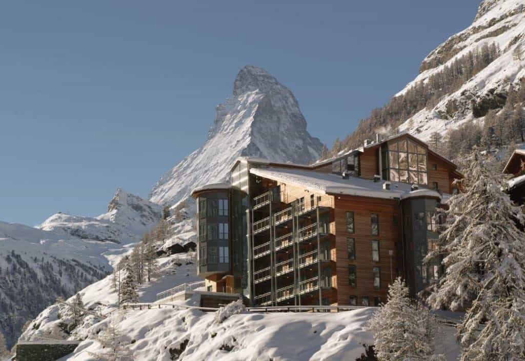 A view of The Omnia, a luxury hotel in Zermatt, sitting in front of the iconic Matterhorn.