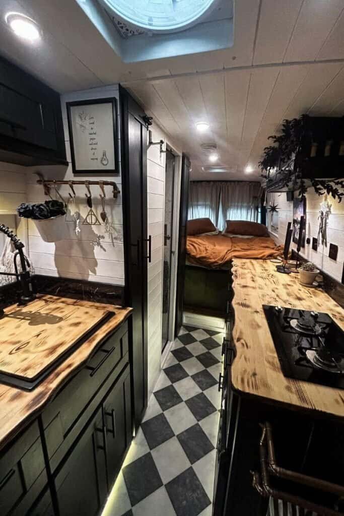 A professionally converted campervan, with all the needs for living in a van. A black and white aesthetic with bespoke worktops.