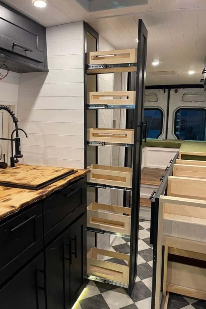 Living in a van requires clever storage solutions, like this floor to ceiling food larder in a Mercedes Sprinter.