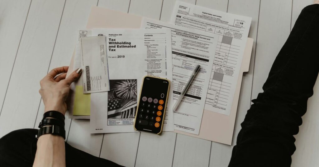 Tax forms spread on the floor.