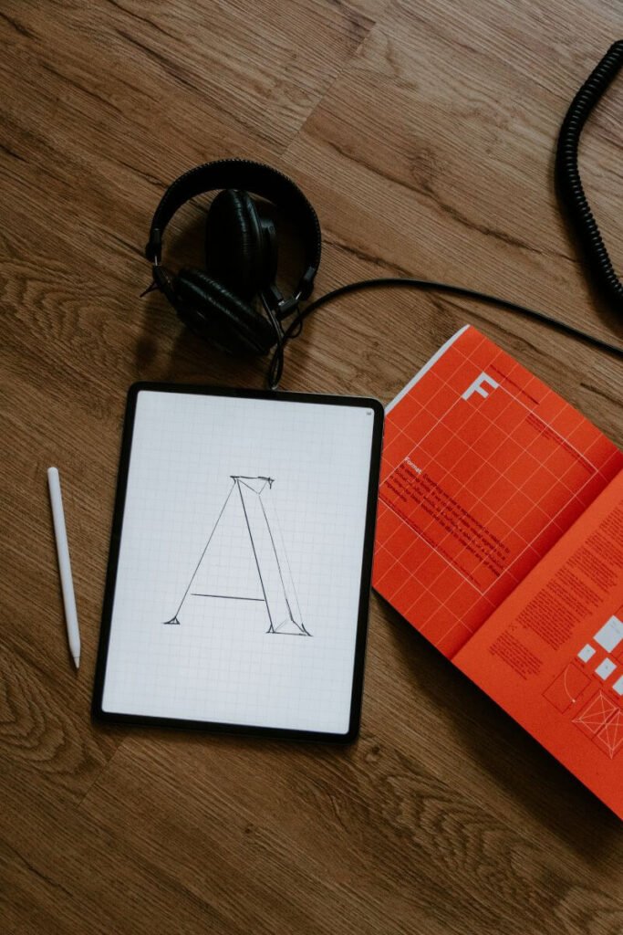 Graphic tablet with the letter A. Graphic Design is a great remote jpb on the road.