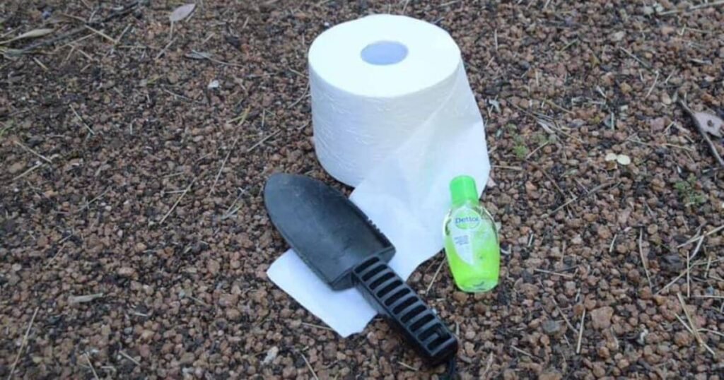 A Poop Shovel, Loo Roll and Hand Sanitiser Laid on the Floor: The Going in the Wild Toilet Option for Van Life