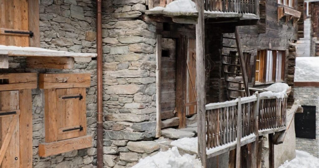 the rustic buildings of Zermatt old town in December.