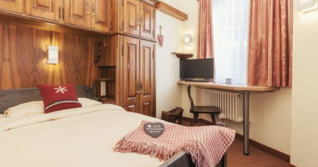 Where to stay in Zermatt on a budget - Cosy traditional Swiss rooms at Le Petit Charme Inn. 