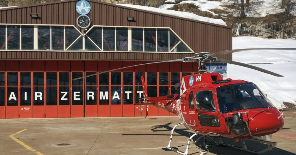 A helicopter parked at Air Zermatt Base station.