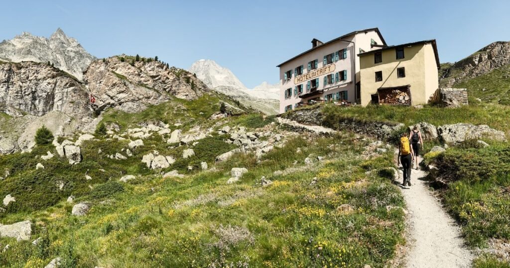 Two hikers making their way to Hotel du Trift in Zermatt.