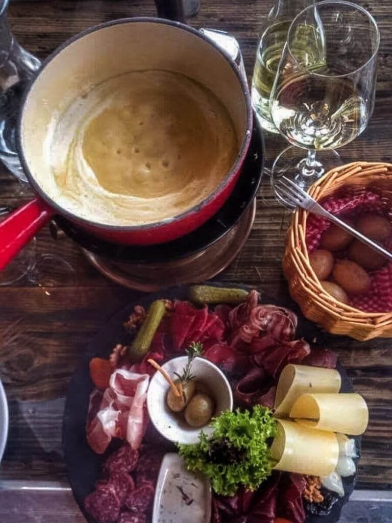 A fondue pot with a selection of local meats and cheeses from the Valais region of Switzerland.